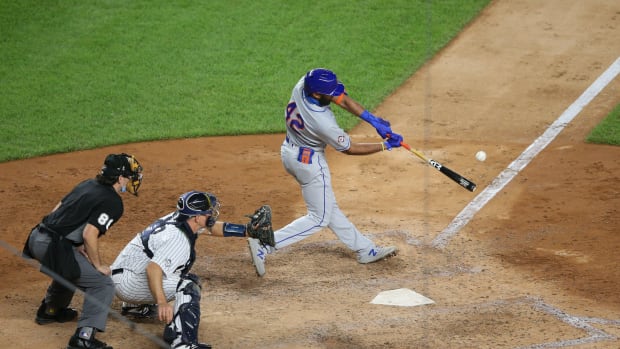 Aug 28, 2020; Bronx, New York, USA; New York Mets shortstop Amed Rosario (1) hits a walk-off two-run home run against the New York Yankees during the seventh inning of the second game of a double header at Yankee Stadium.